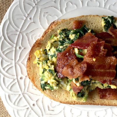 open-faced bacon and egg breakfast sandwich